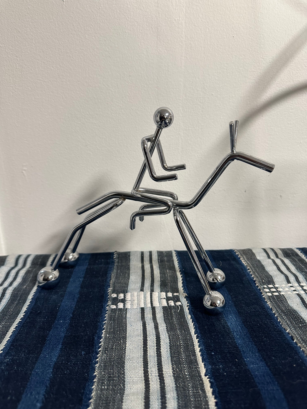 Chrome Person on Horse Sculpture